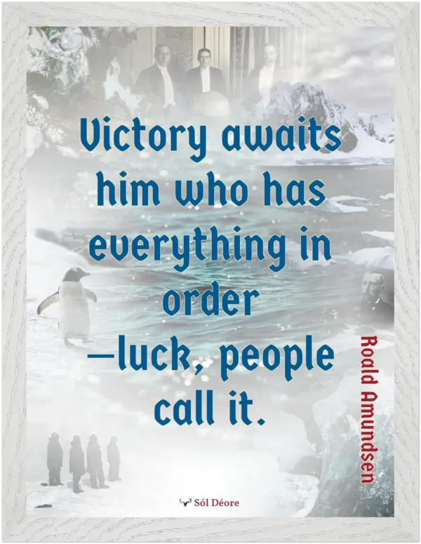 A white framed print with a quote from Roald Amundsen, 'Victory awaits him who has everything in order—luck people call it'.
